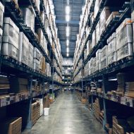 warehouse with storage boxes - plex demandcaster