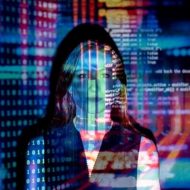 woman standing in front of data screen projection