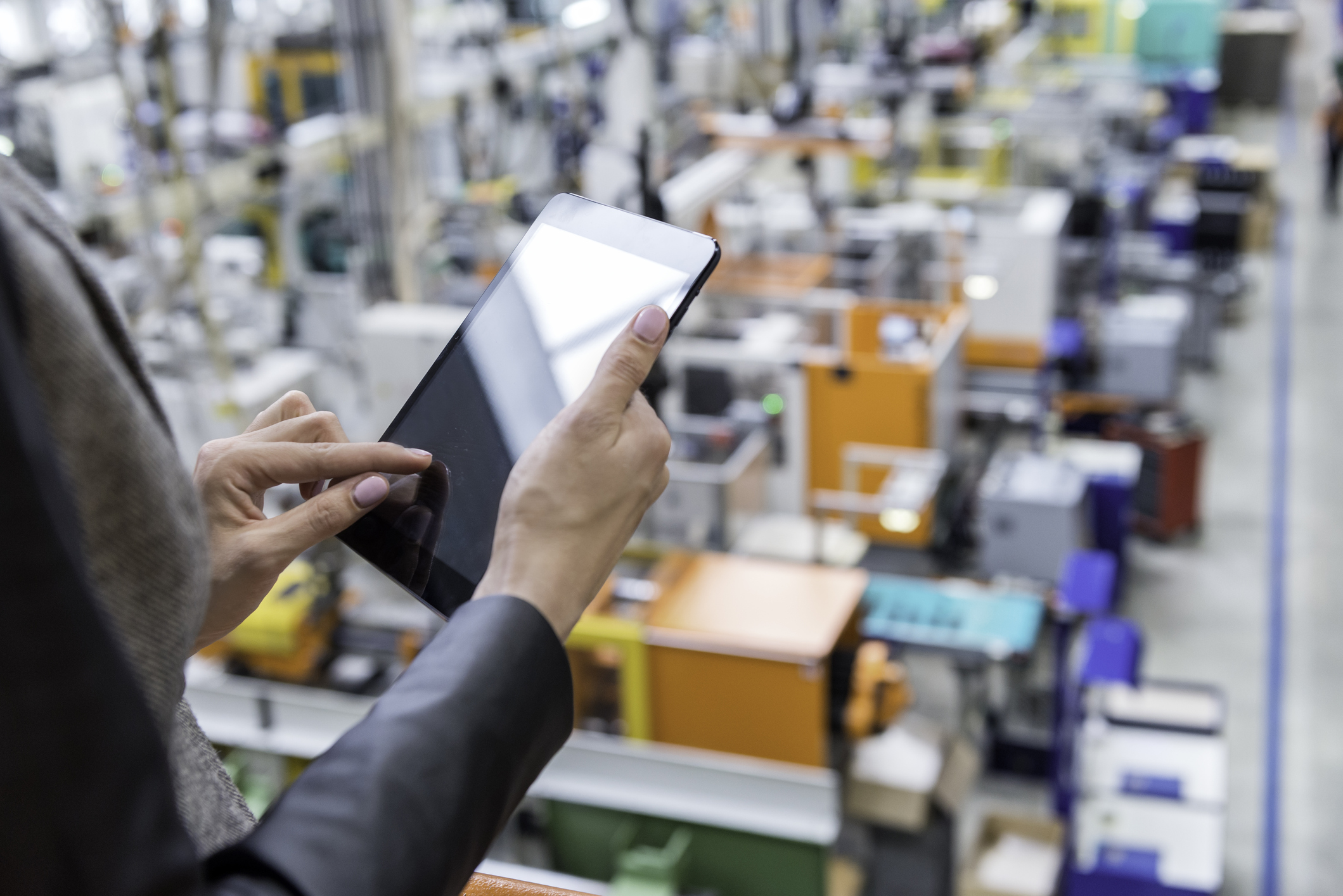 worker using tablet in factory