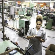 woman using digital tablet in a factory